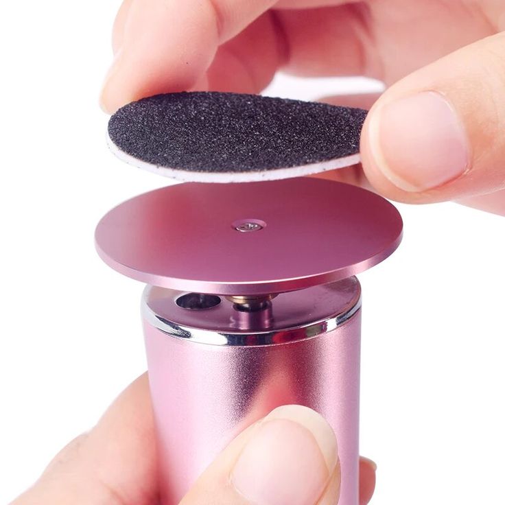 SmoothSole electric foot file with replaceable roller head on a bathroom counter