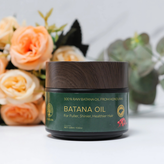 BatanaHair pure batana hair oil bottle with dropper on neutral background
