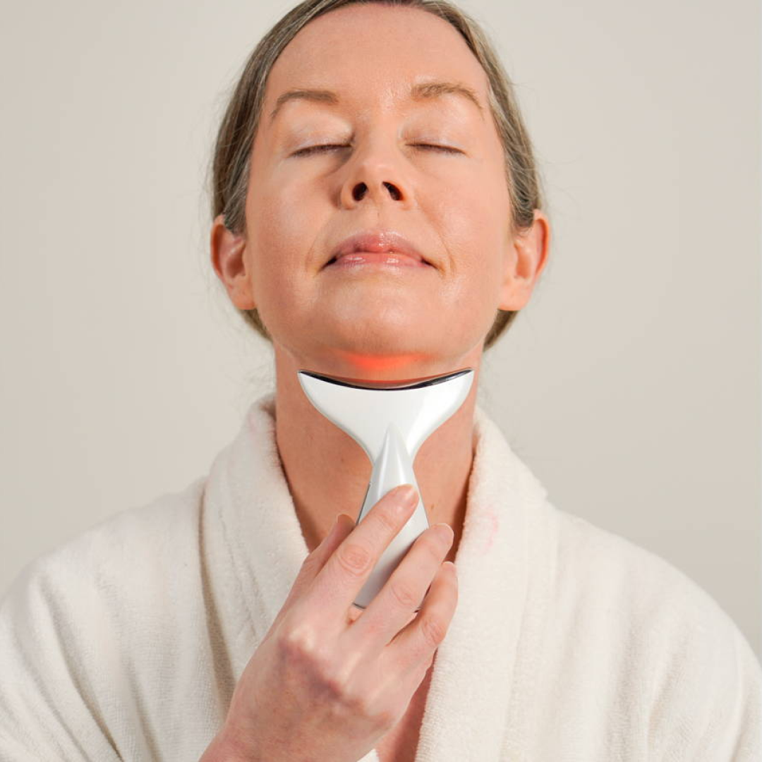 Close-up of PulseLift applicator and charging port—handheld, portable skin-toning device