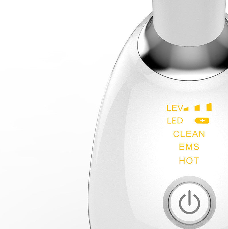 Close-up of PulseLift applicator and charging port—handheld, portable skin-toning device