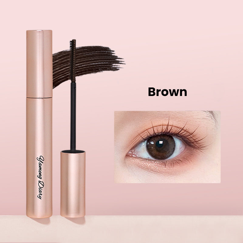 FeatherLift lengthening mascara—wand and tube next to model lashe