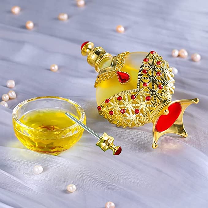 Sultan Aura Gold perfume oil — ornate gold bottle with dropper in palace setting